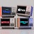 Four old-style television sets are stacked in two rows and each screen displays a different streaming service logo: Disney+, Apple TV+, Netflix, and Prime Video.